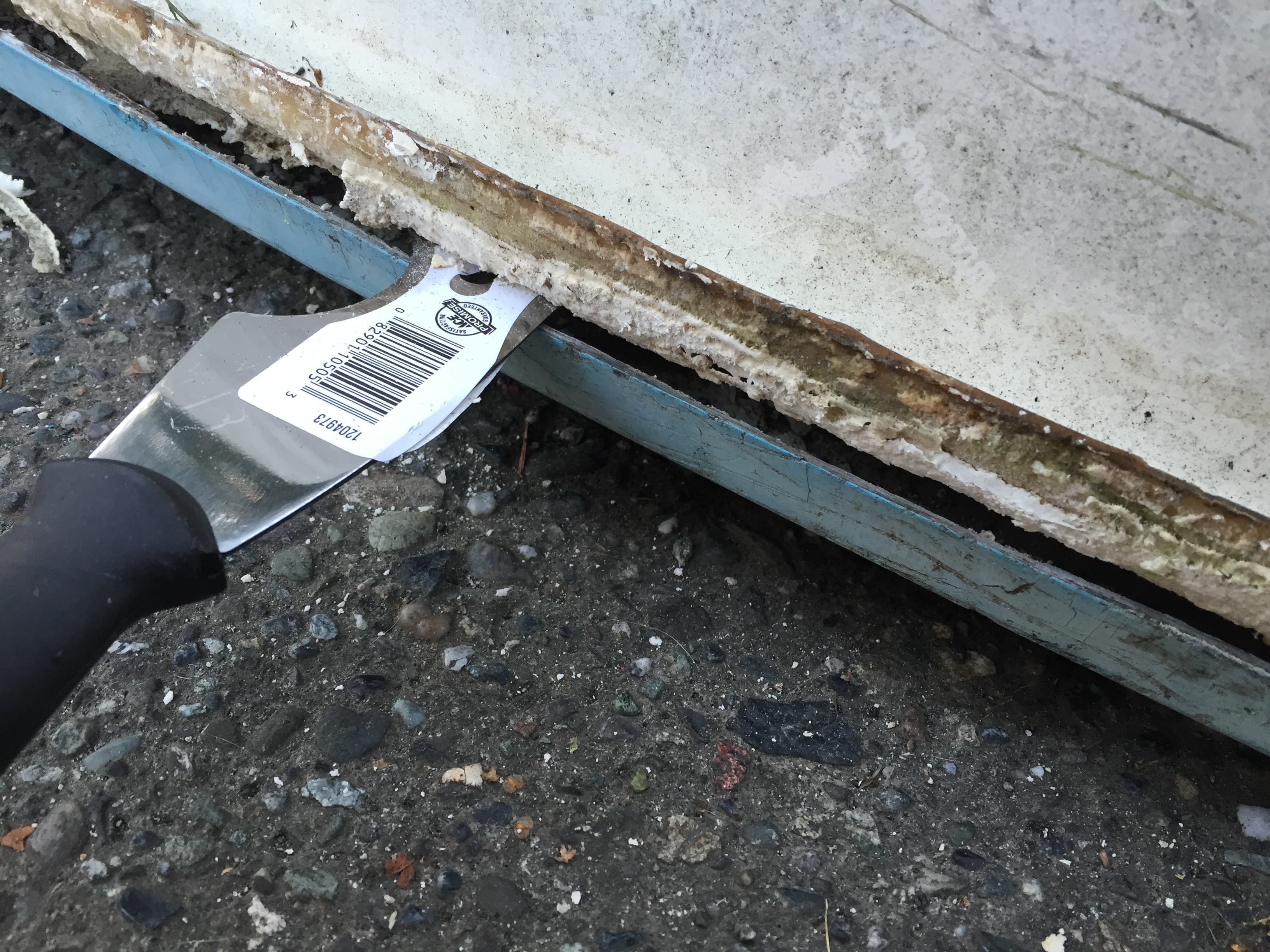 Stripping the old adhesive with Marine Formula by Debond Corp