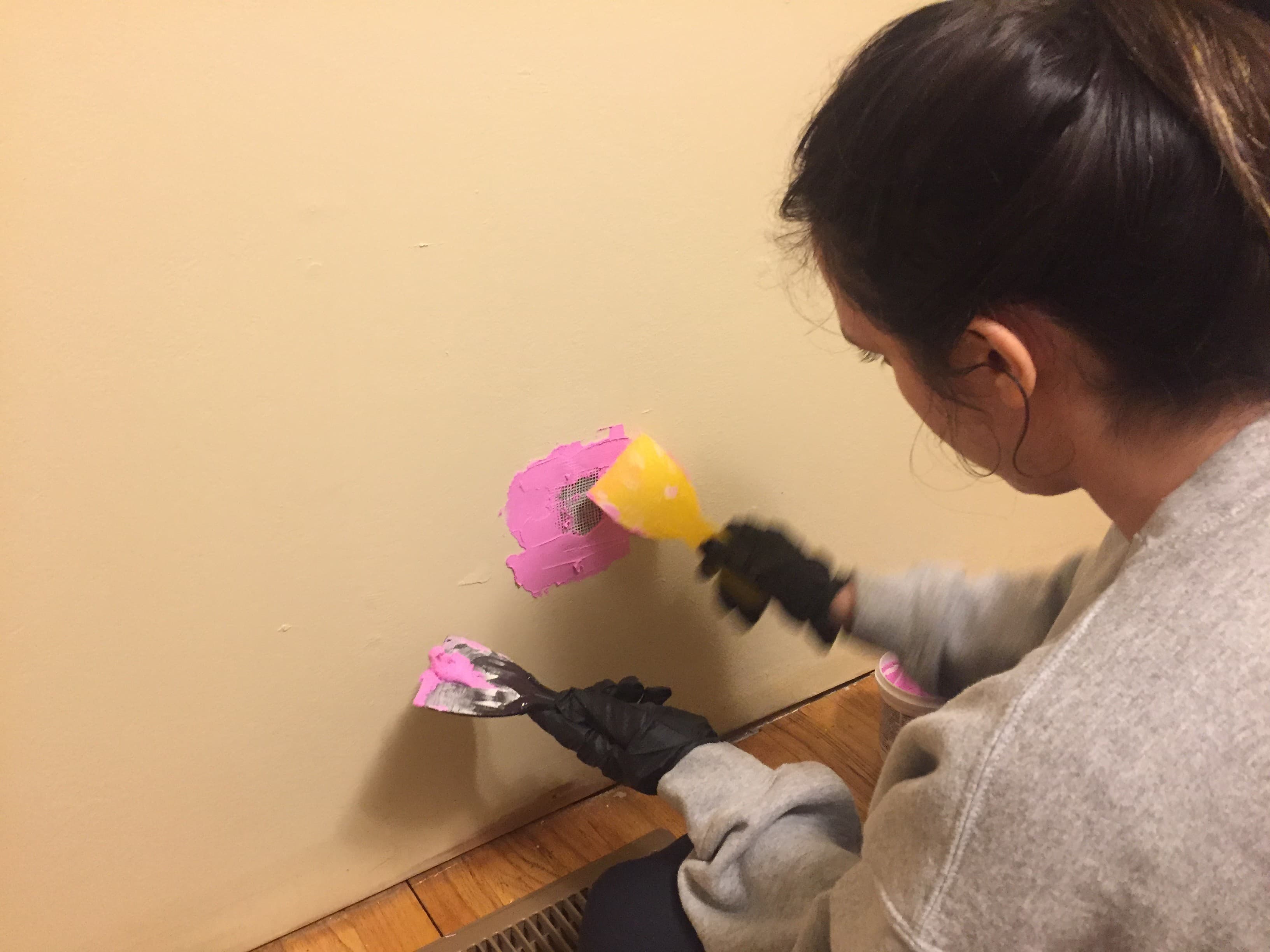 Alix patching them walls
